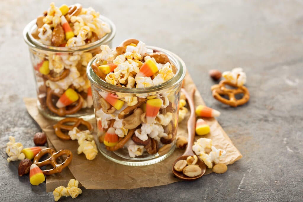 Homemade Halloween trail mix with candy corn, popcorn and pretzels