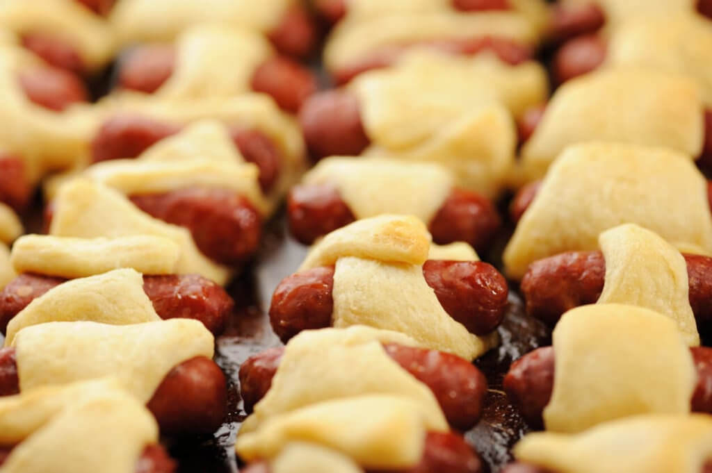 Close up of sausage rolls or pigs in a blanket after being cooked