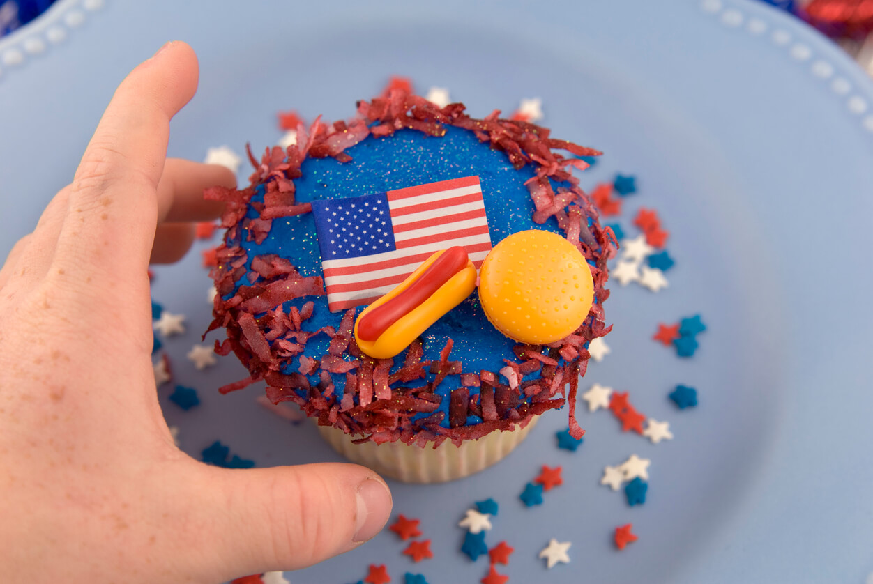 Child Hand and Patriotic Cake, July Fourth & Labor Day Cupcake Background