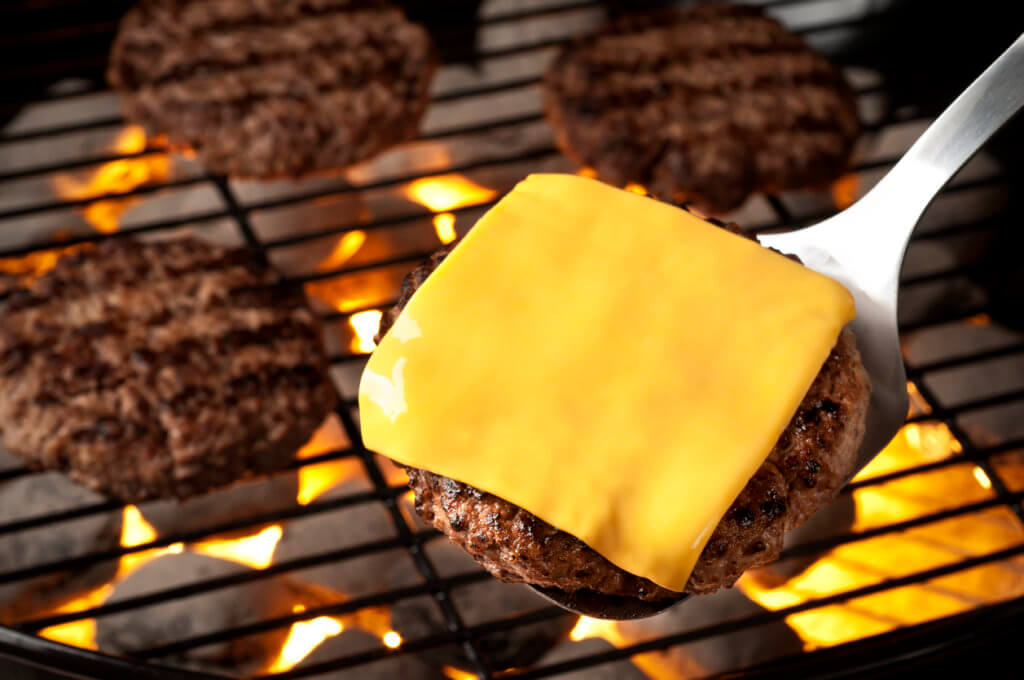 Grilled burgers on the grill.