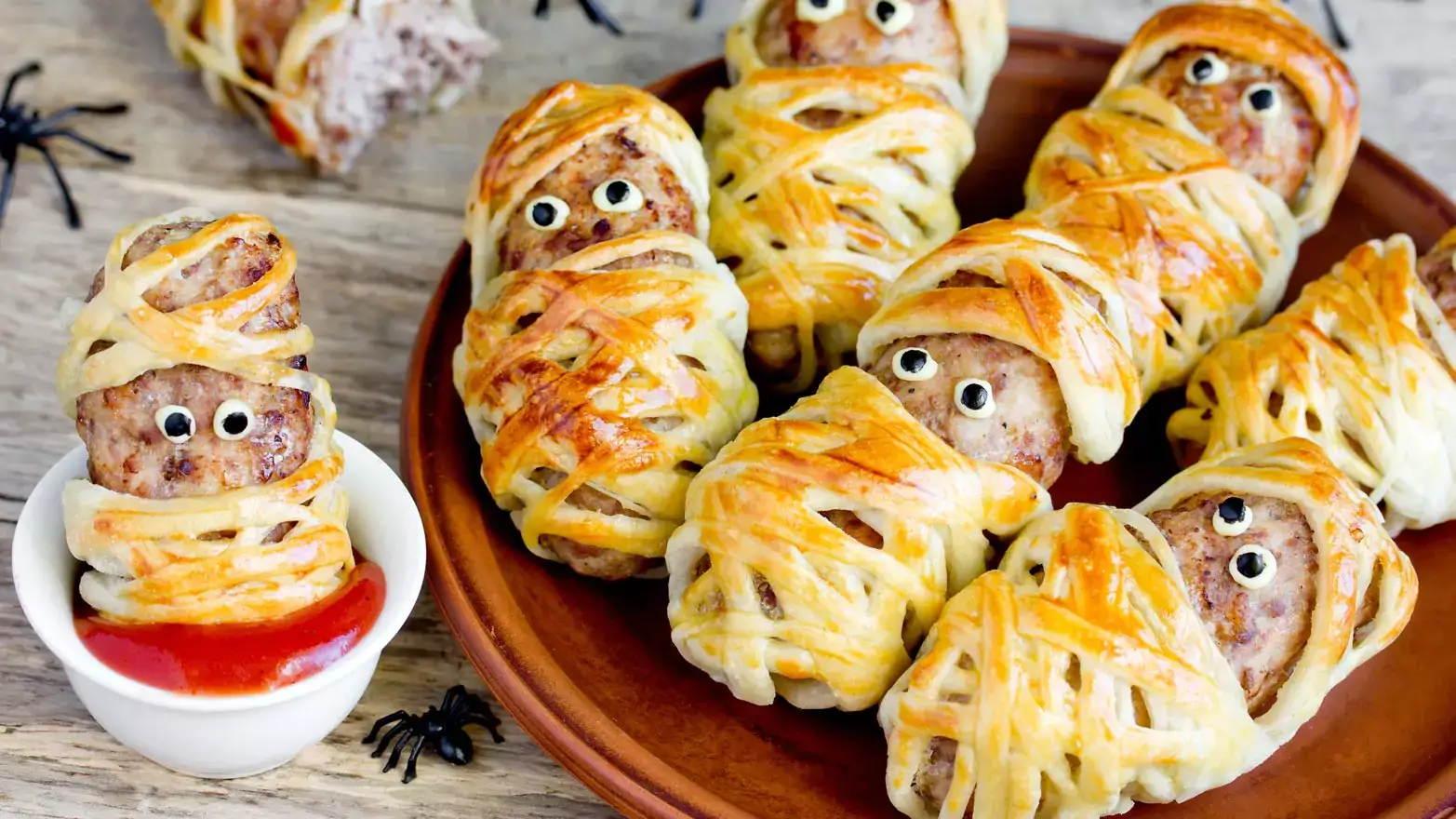 Sausages wrapped in pastry dough with edible eyeballs