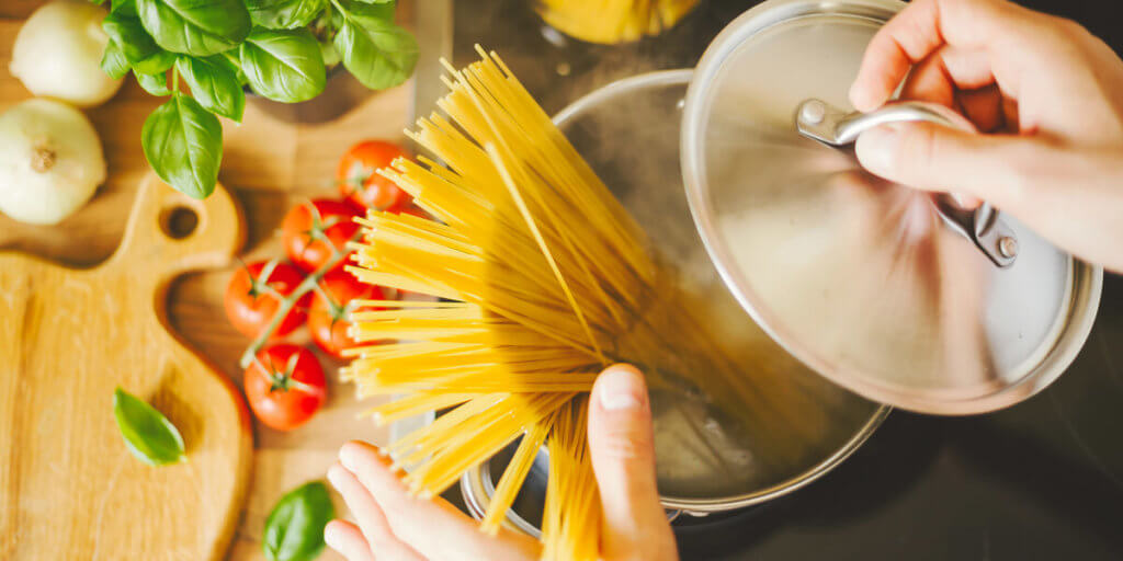 Cooking pasta in stove pot.