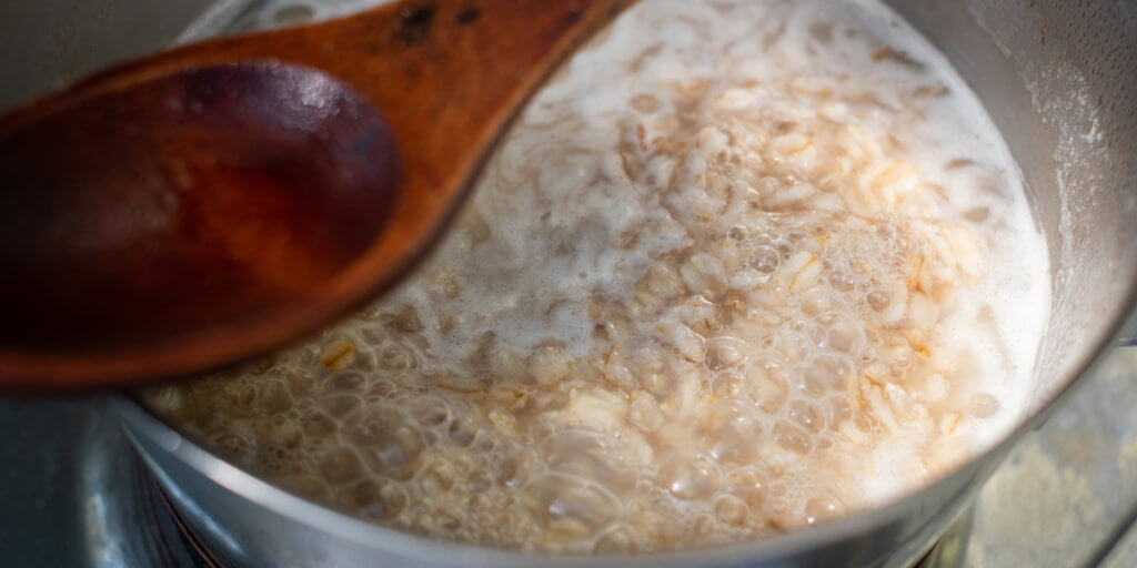 Oatmeal cooking on stovetop.