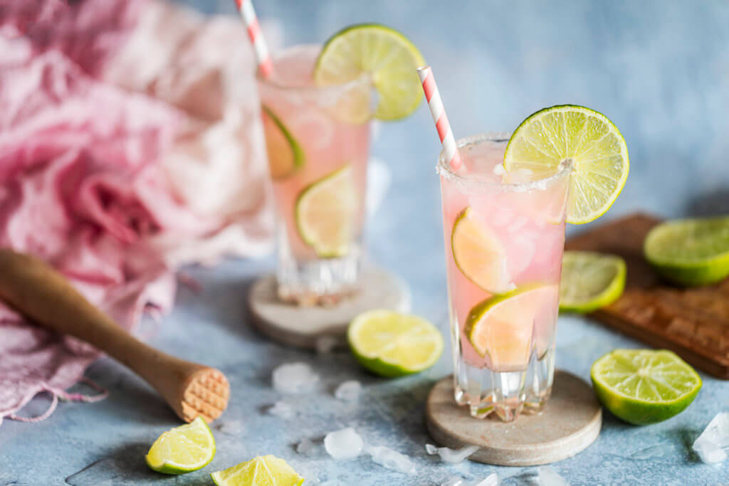 A fresh cocktail drink with lime and pink grapefruit juice. Paloma cocktail.