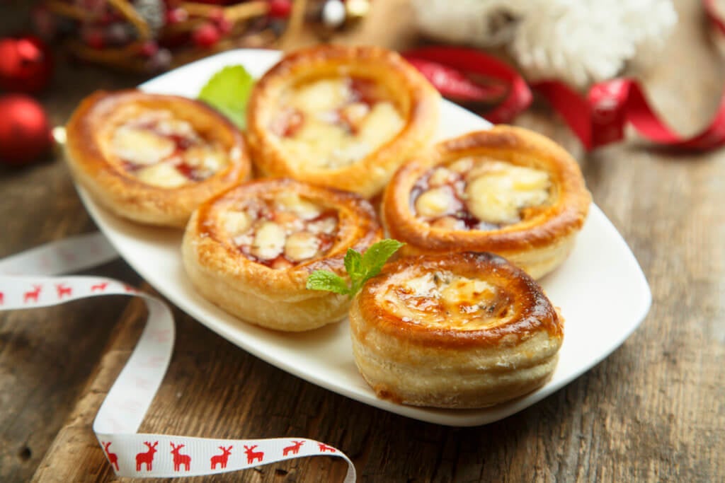 Hot puff pastry appetizer with cheese, turkey and cranberry.