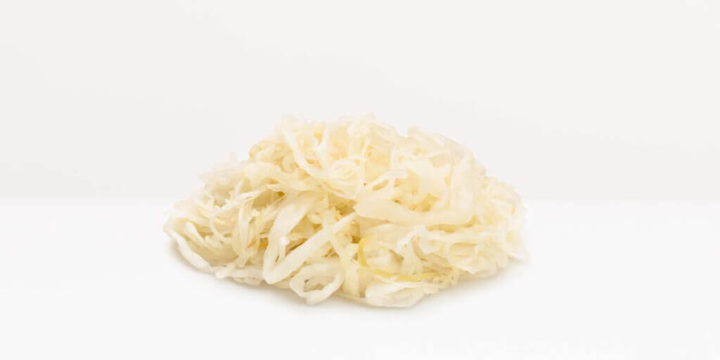 Sauerkraut, grocery store produce, on a blank background.