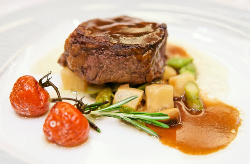 Tenderloin steak in plate, close-up.