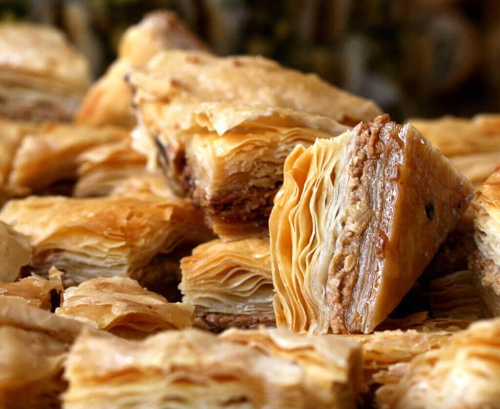 Freshly baked baklava triangles on display in Montreal.
