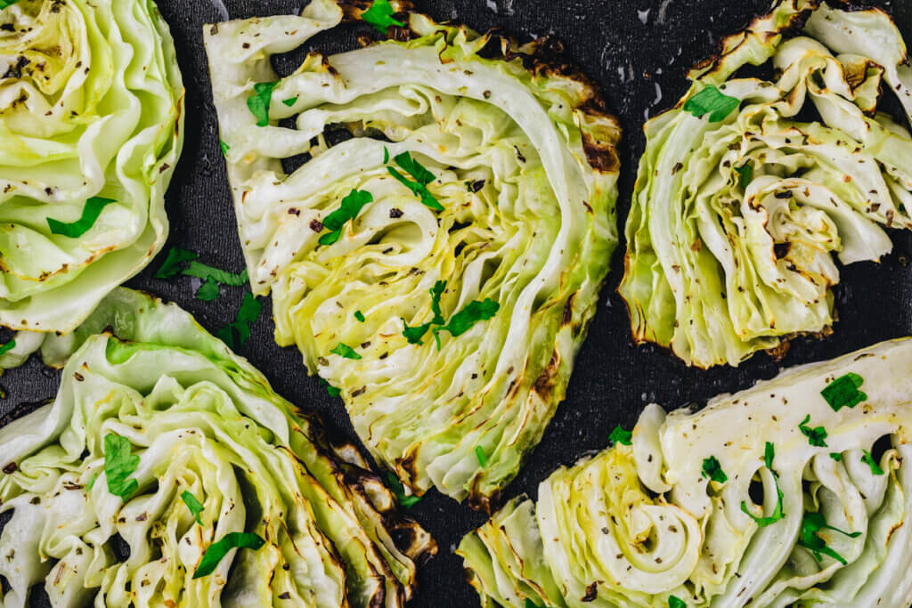 Baked or grilled white cabbage pieces with parsley