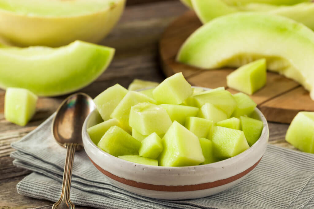 Green Organic Honeydew Melon Cut in a Bowl