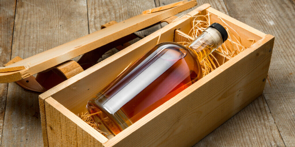 Gift box in wooden crate with barrel aged whisky