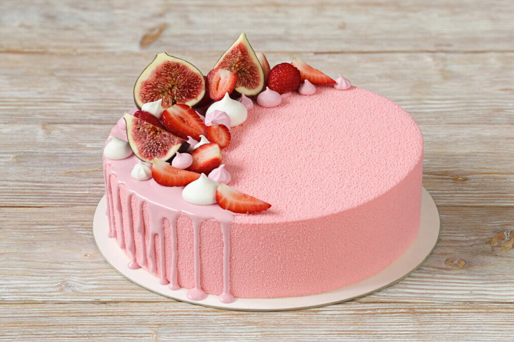 Pink mousse cake with mirror glaze and merinques