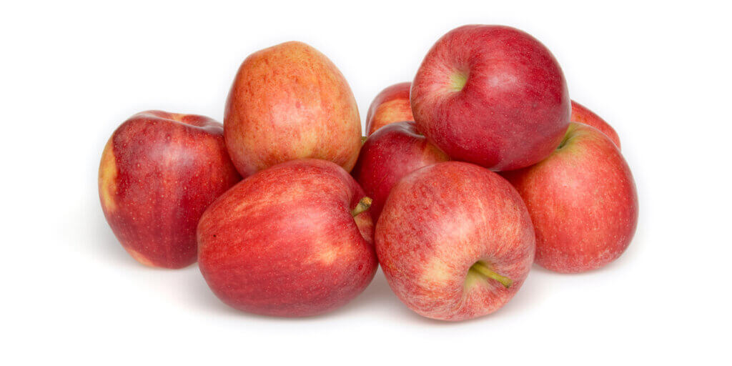 red apples, grocery store produce, on a blank background.