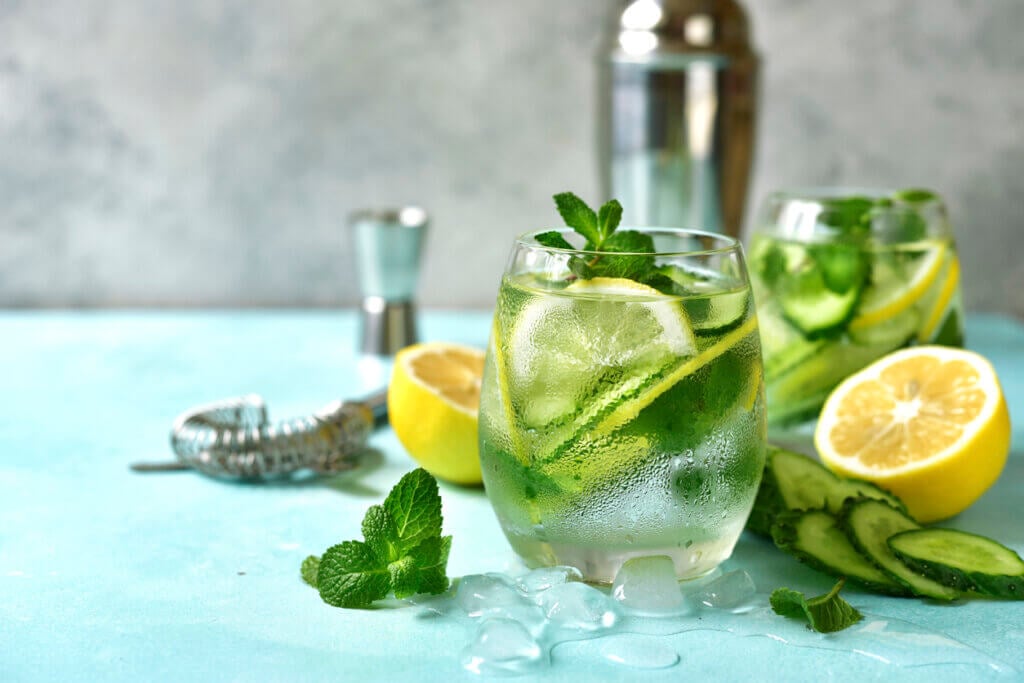 Cucumber and lemon refreshing drink with mint in a glasses.
