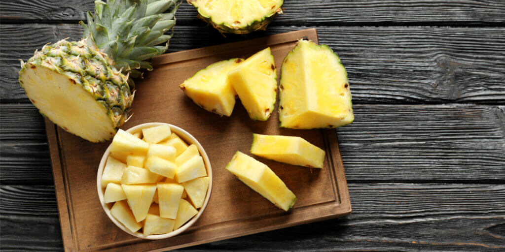 slices of pineapple on a cutting board.