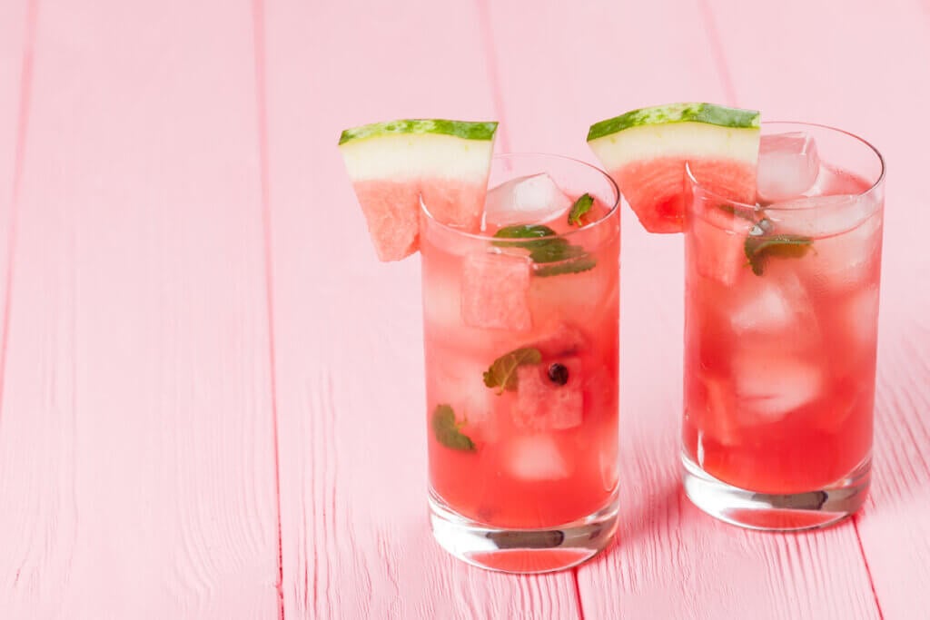 Watermelon lemonade with ice and mint leaves.