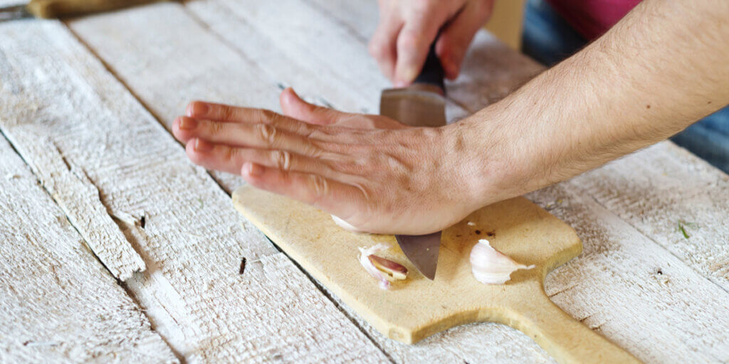 Cutting garlic by hand.