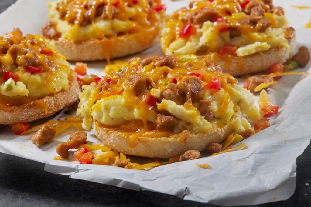 English Muffin Breakfast Pizza with Scrambled Eggs. Sausage and Peppers