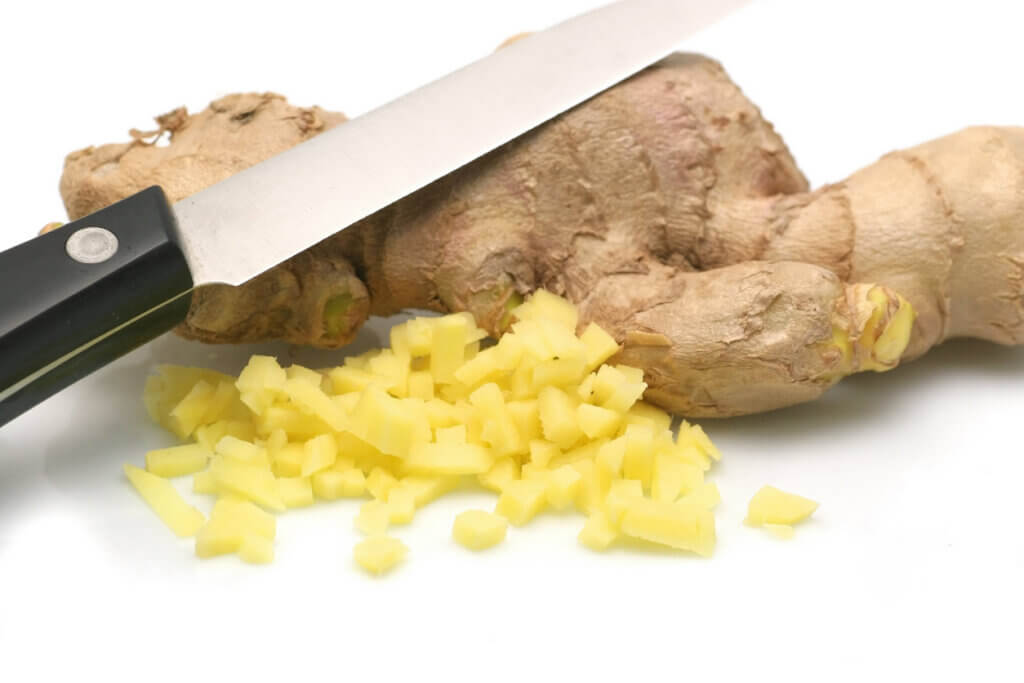 chopped ginger on a white background.