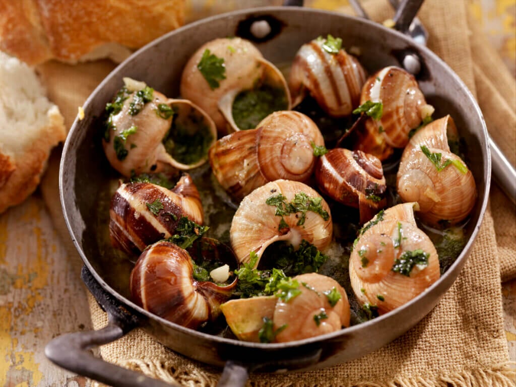 Escargot in a Herb Butter, White Wine and Garlic Sauce with Fresh Parsley and Crusty French Bread