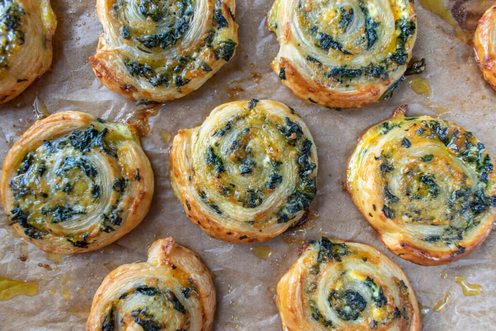 Baked spinach pinwheel puff pastries flat lay