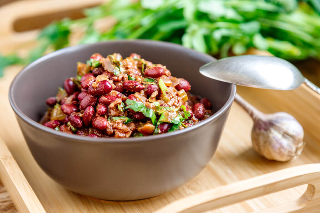 Lobio with red beans. Traditional Georgian dish of stewed beans and walnuts close-up