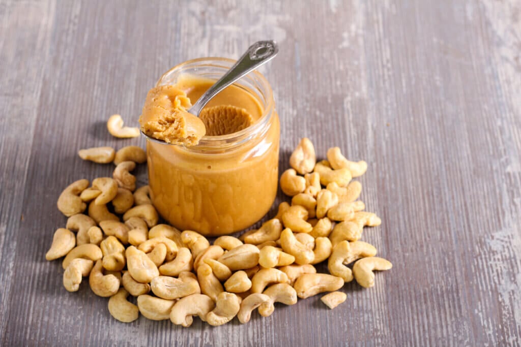 Cashew butter spread in a jar and cashew