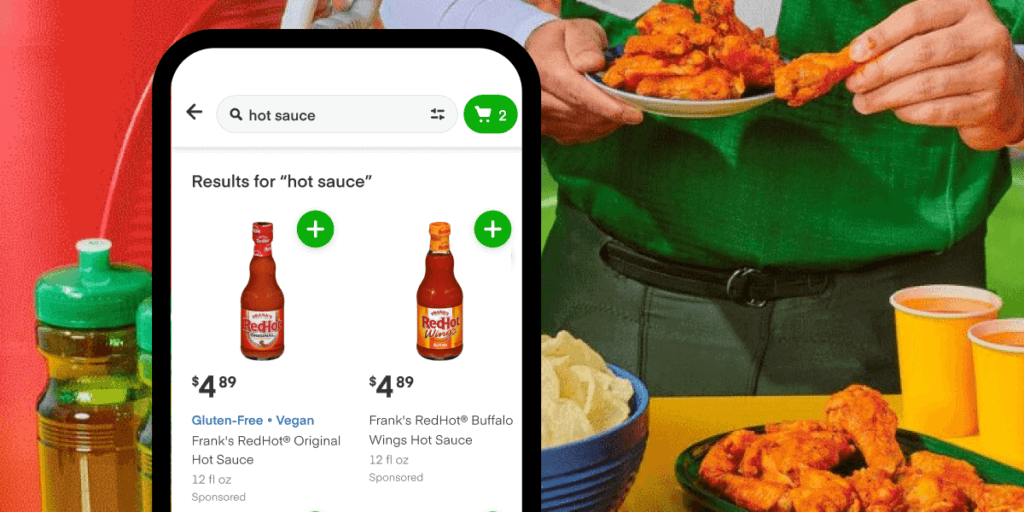 Smartphone with Instacart app. Searching for 'hot sauce' and finding Frank's RedHot. 