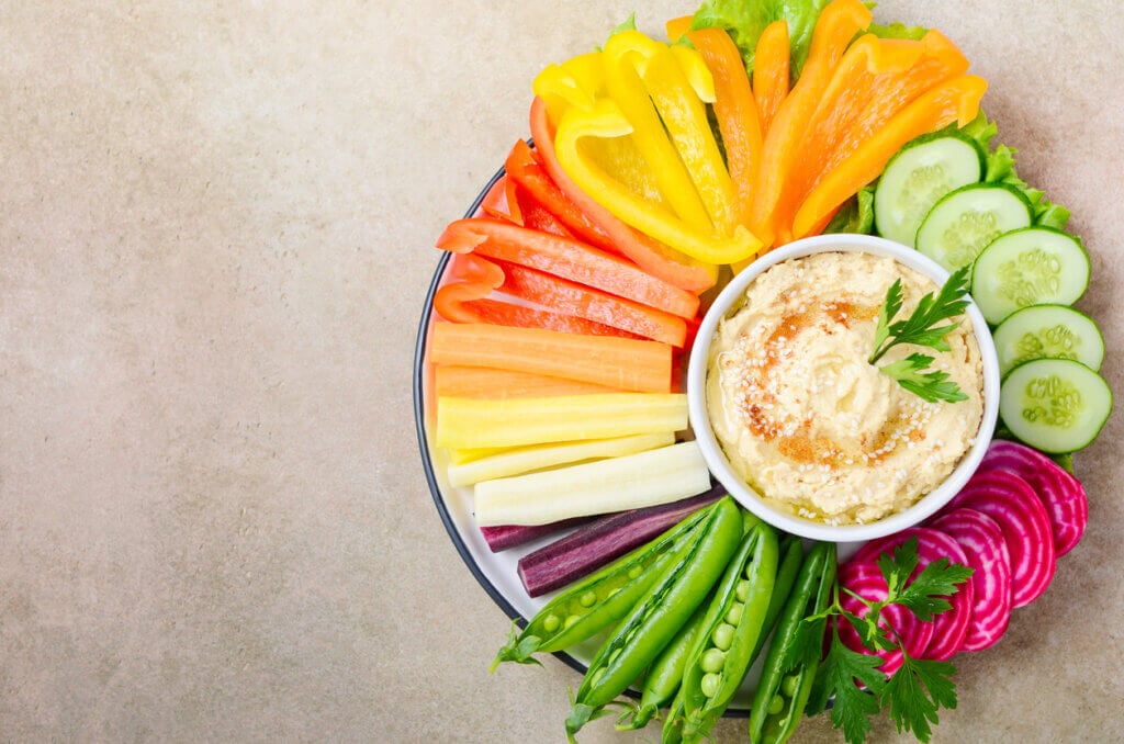 Hummus platter with assorted vegetable snacks. Healthy vegan and vegetarian food.