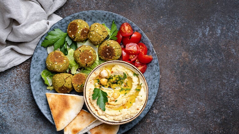 Combine two greek classics with falafel and hummus. 