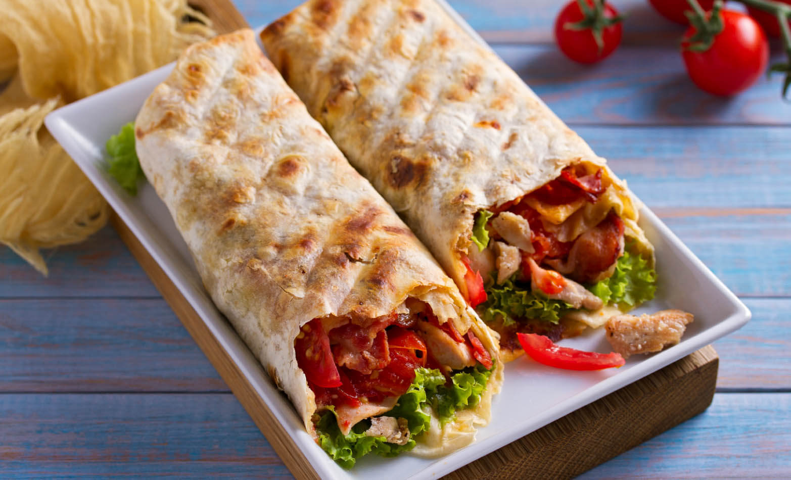 chicken caesar salad wraps with tomatoes and bacon