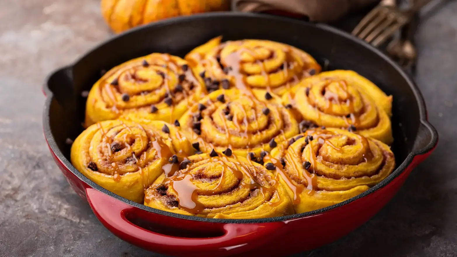 Pumpkin cinnamon rolls in pan