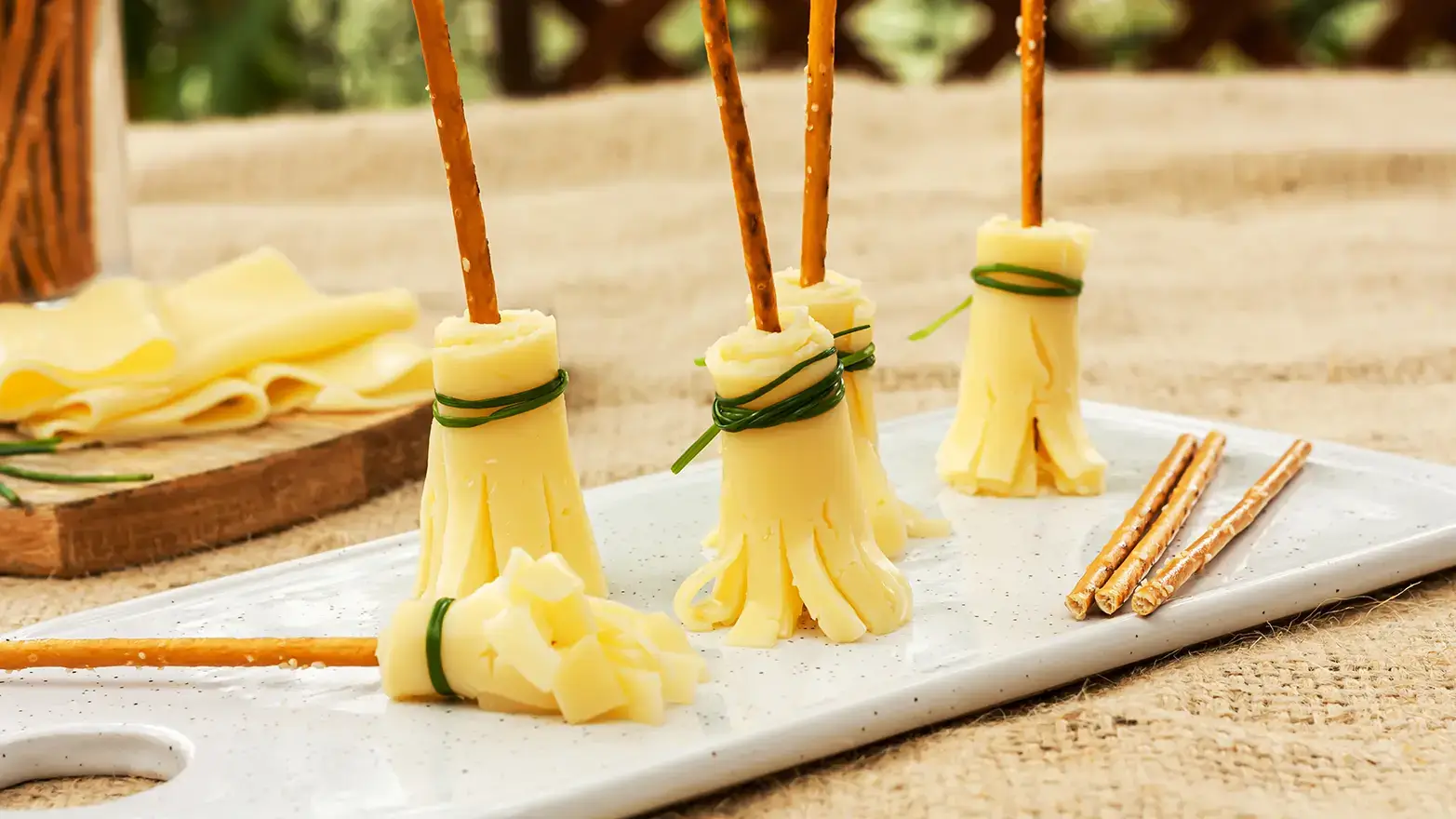 Witch’s brooms Halloween appetizers made from pretzels and cheese