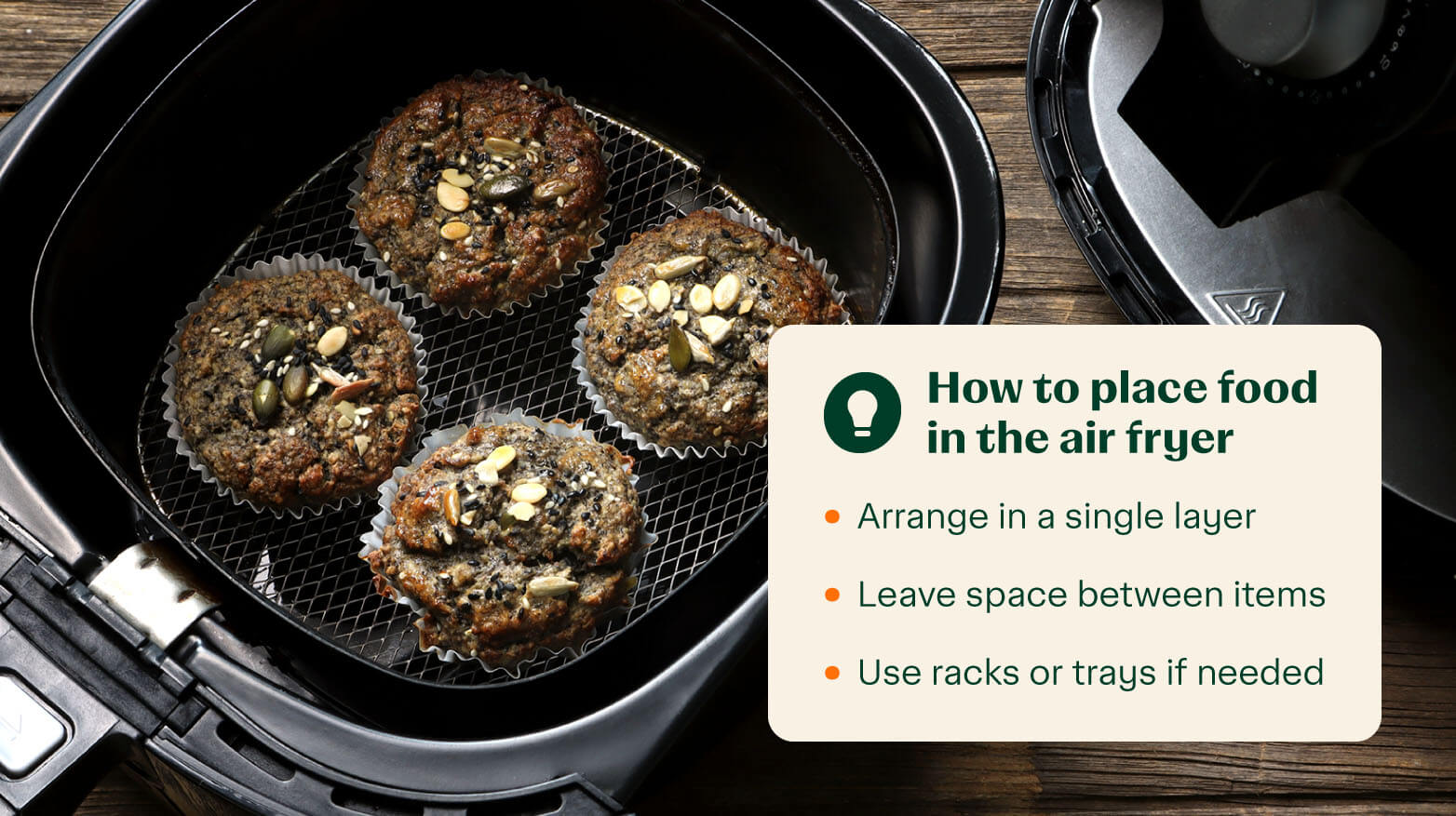 Four muffins in air fryer basket with directions on how to place food in an air fryer. 