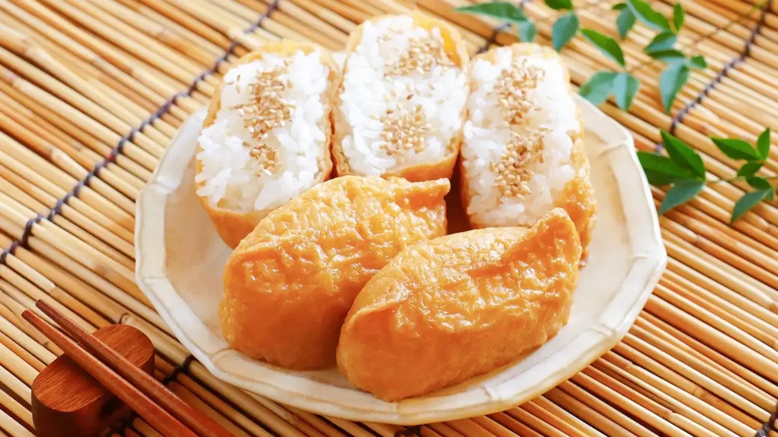 inari sushi served in a bowl topped with sesame seeds