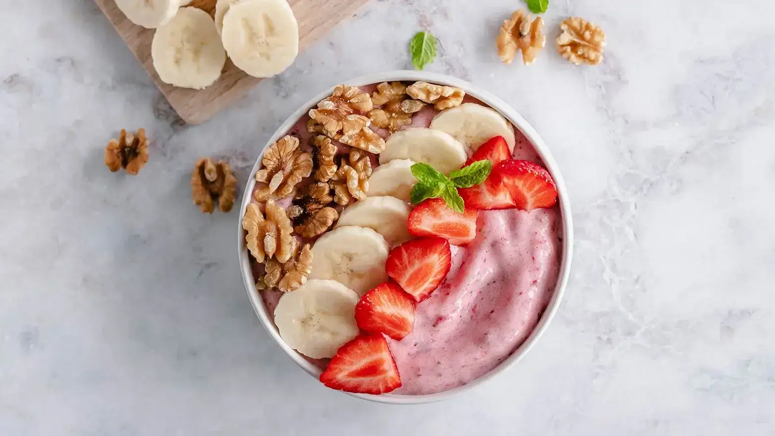 strawberry and banana puree with fruit and granola