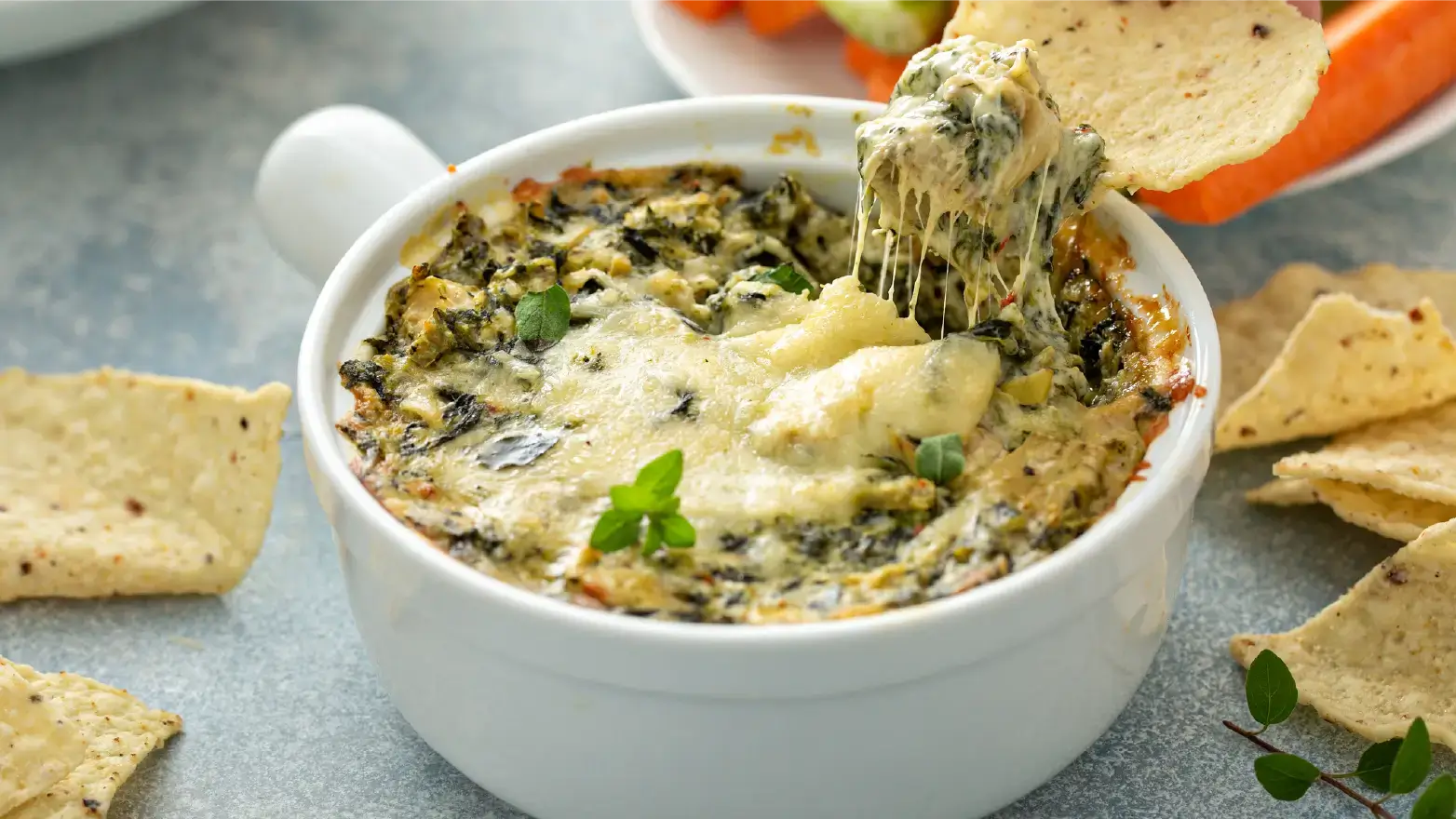 bowl of spinach artichoke dip with chips